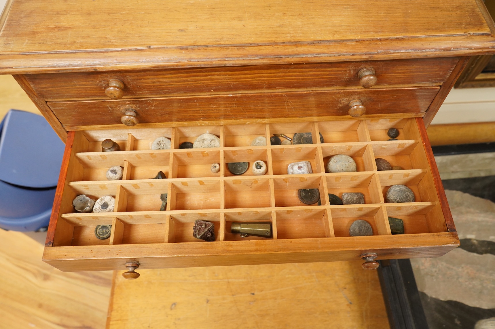 A collection of mainly 16th century to 19th century bronze and lead imperial circular trade weights stamped with Royal Cyphers, weights, the dagger assay mark for London, the ewer mark, other proof marks, etc., together